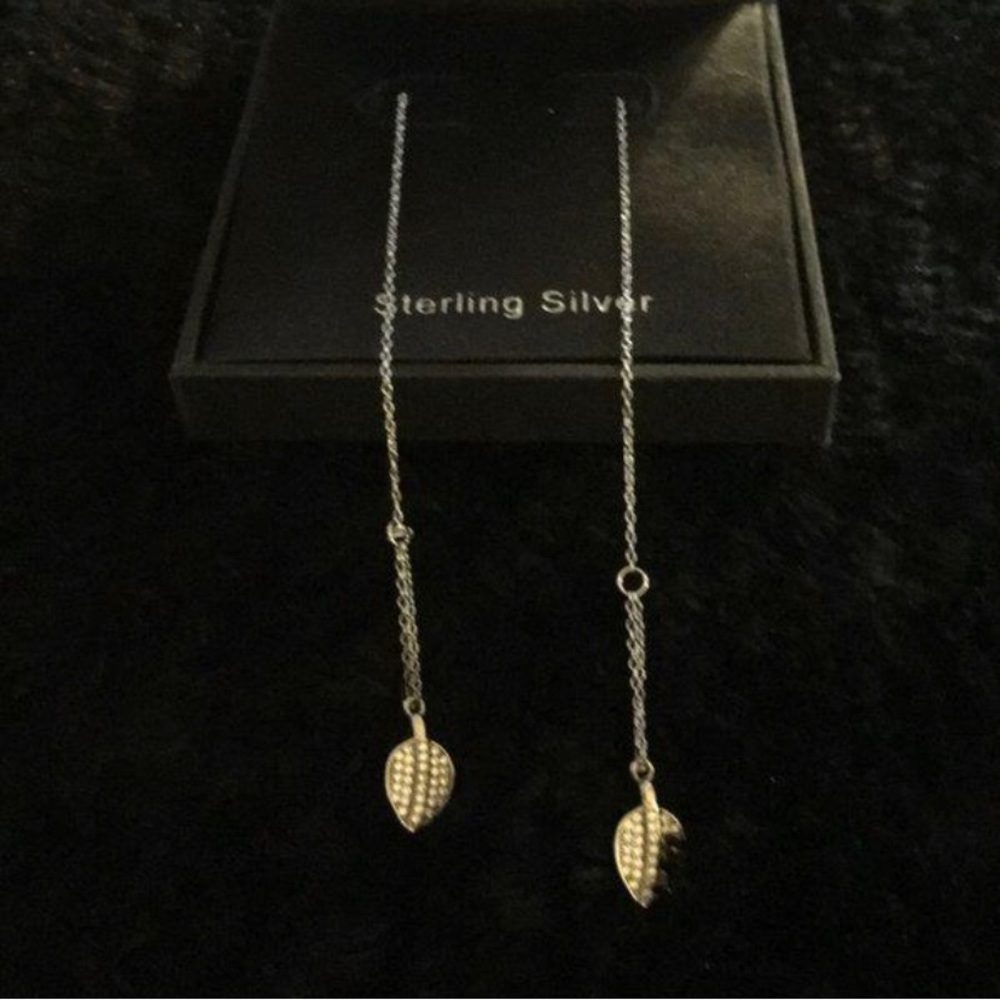Silver long earring with leaf at the end